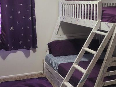 3 bed bunk bed with 3 mattresses,dresser,rug,sheets and curtains