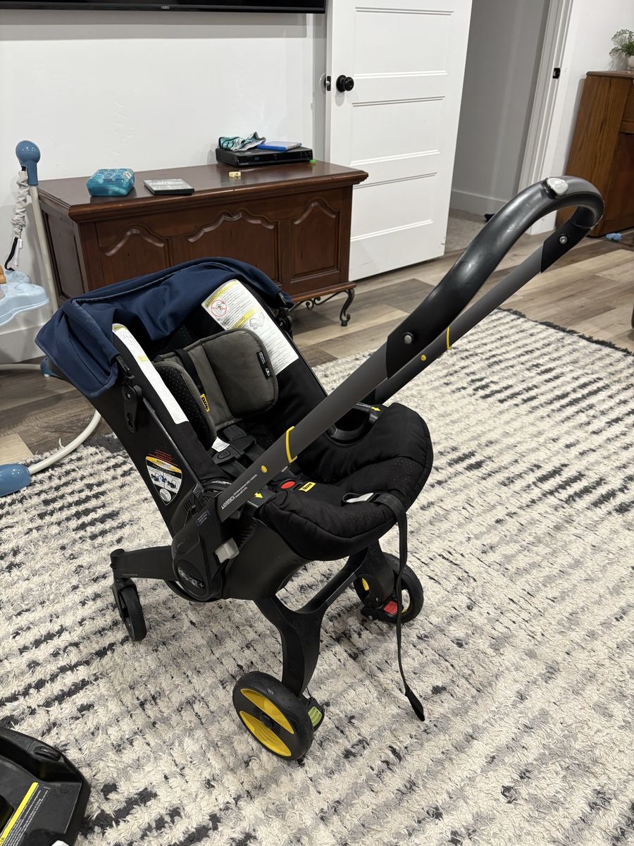 Doona Infant Car Seat & Stroller - Blue/Black, Integrated Design for Travel