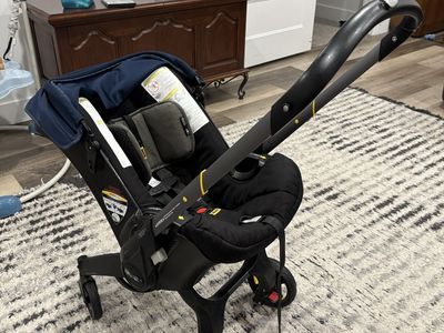 Doona Infant Car Seat & Stroller - Blue/Black, Integrated Design for Travel