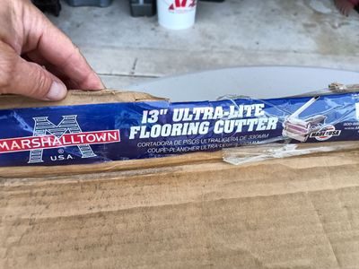 New in box flooring cutter. 13 inches wide.