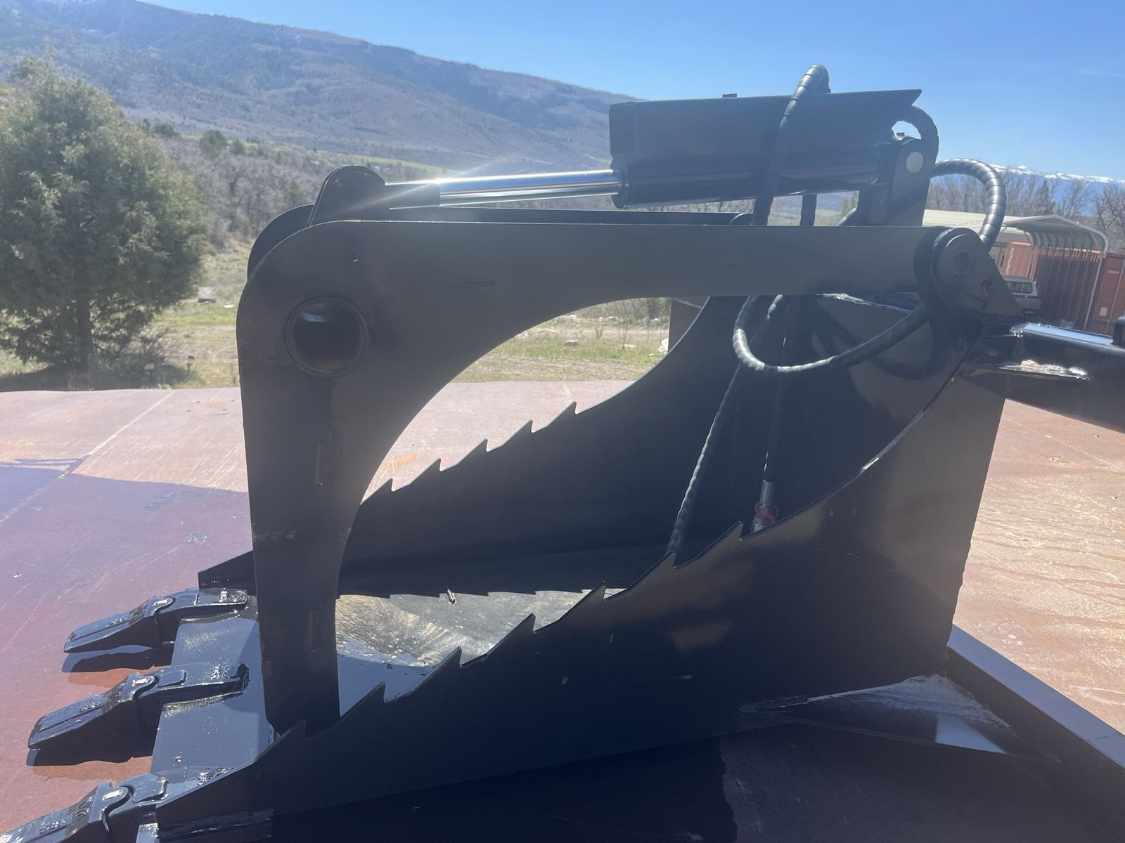 Skid steer stump / rock grapple attachment