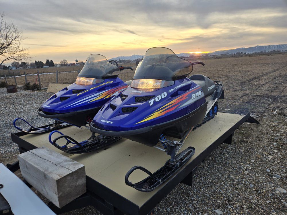 two snowmobiles  for sale