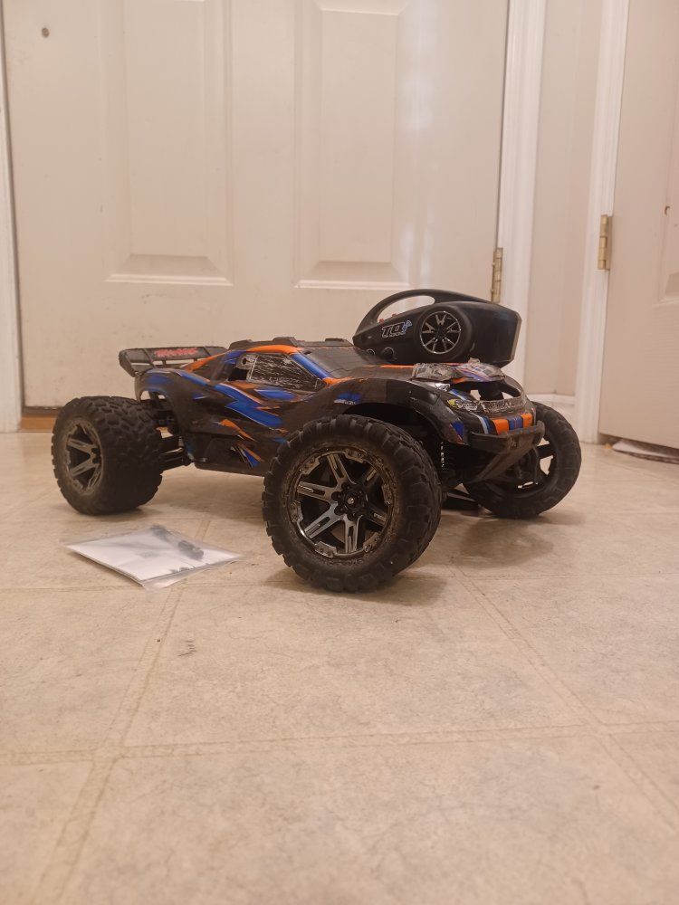 Traxxas Rustler 4x4 vxl 3s
 with remote, extra Turnbuckl, tool, and gear mesh adapter.