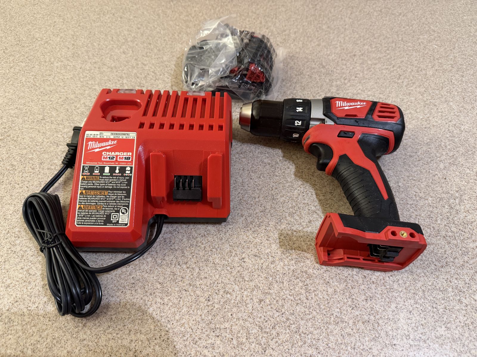 Brand new Milwaukee M18 Drill, 1.5AH battery and charger, tool only