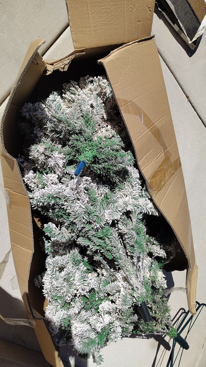 Pine Christmas tree with snow flocked branches