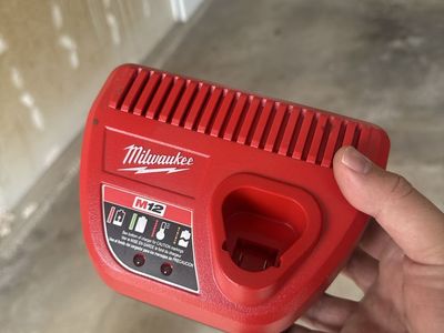 Milwaukee M12 Battery Charger - Power Tool Accessory - Red, Used