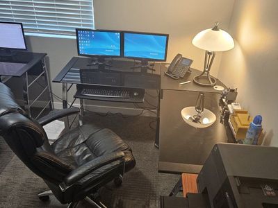 2 x Corner Office Smoke glass table, 2 x Black Leather Executive Office Chairs with High Back and 2x H.D. carpet protector.