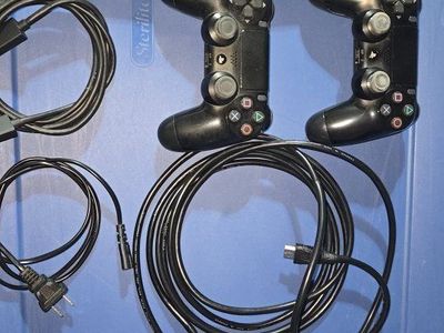 Sony PlayStation 4 (PS4) Slim Console with 2 Controllers and Cables, Black