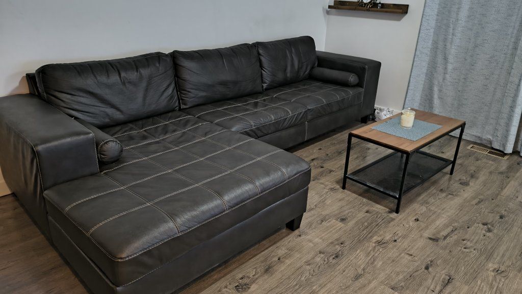 Used Dark Gray Sectional Sofa with Left-Hand Facing Chaise and White Stitching