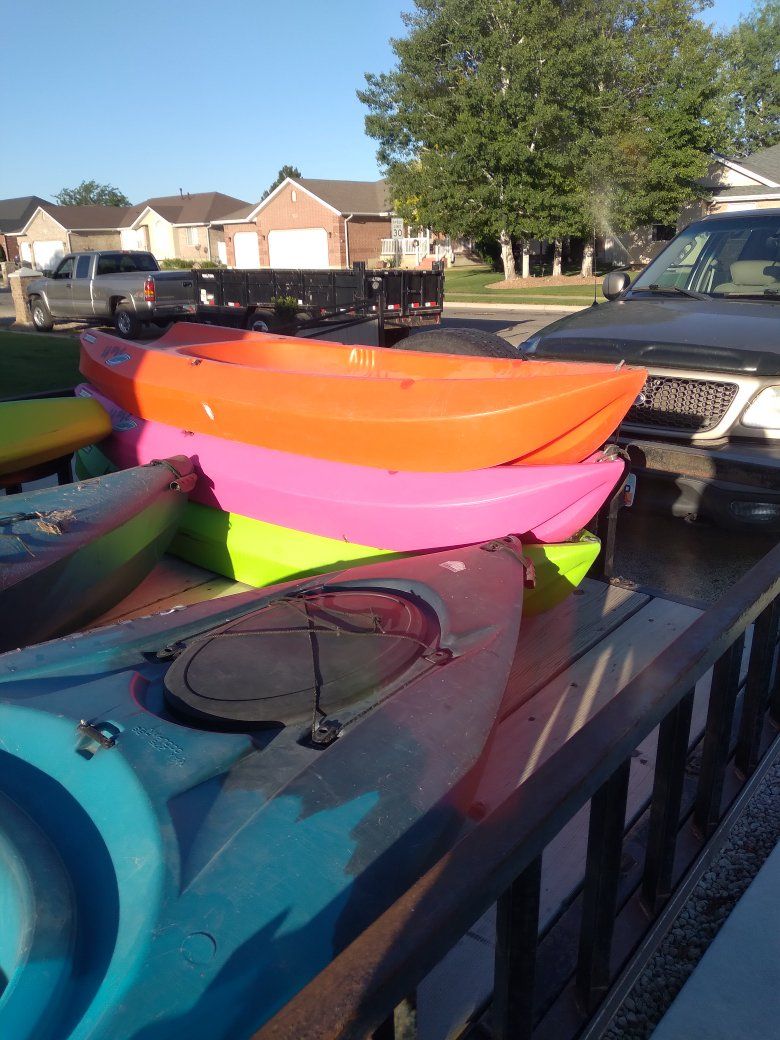 kayaks and paddle board and youth kayaks