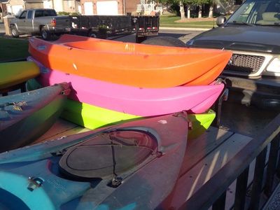 kayaks and paddle board and youth kayaks