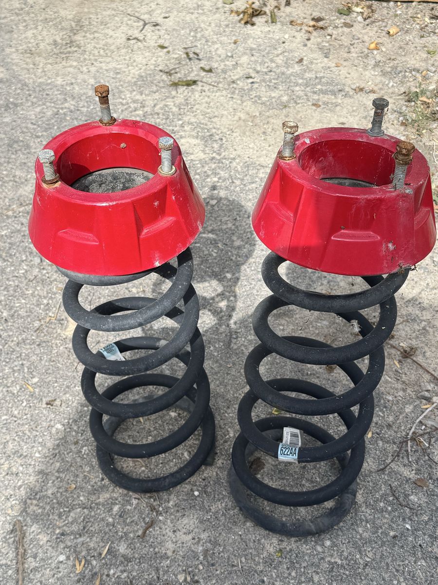 Front springs wth leveling spacers