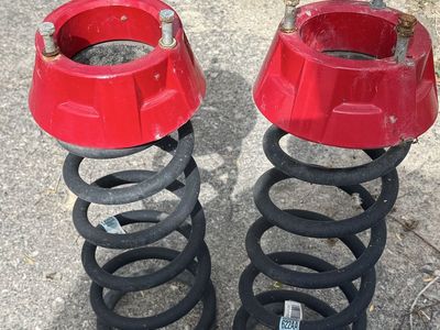 Front springs wth leveling spacers