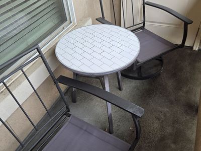 Swivel patio chairs and tiled table