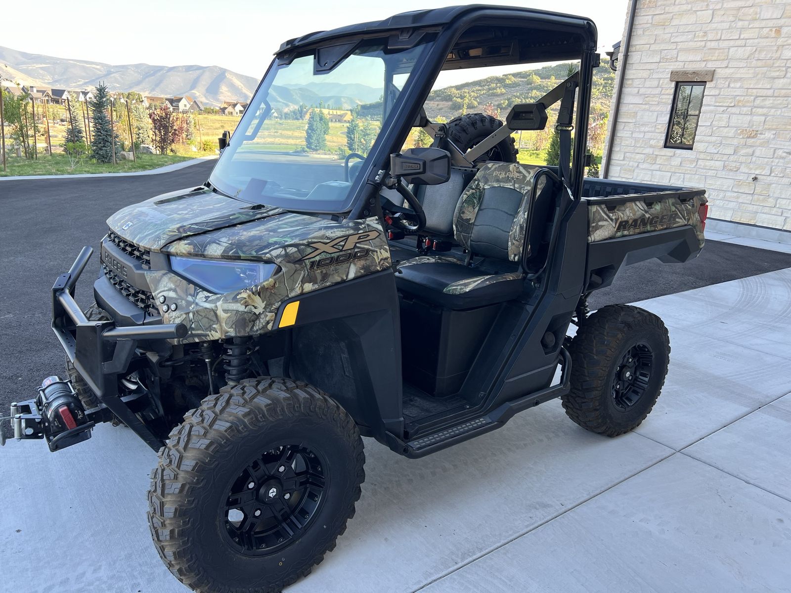 2023 Polaris Ranger XP 1000 Camo Side-by-Side UTV with Winch, Roof, and Spare Tire and more.