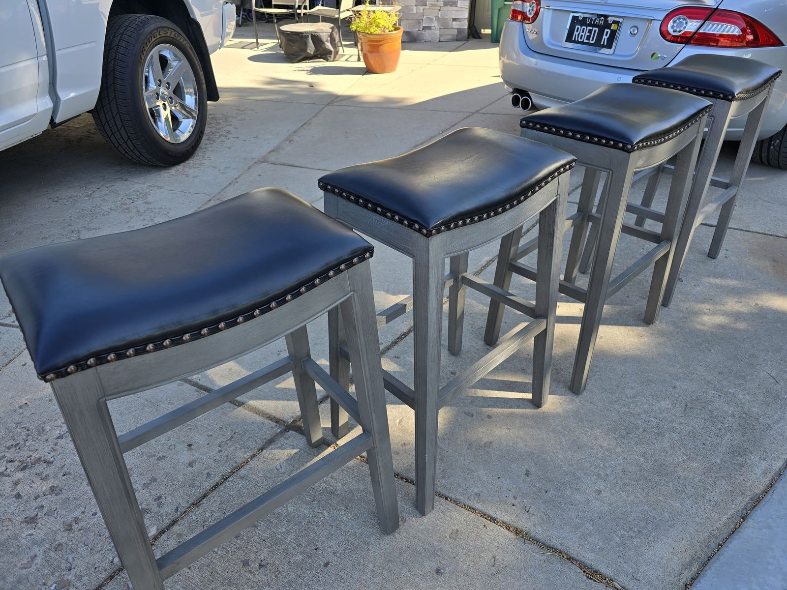 4 leather top GrandinROAD bar stools
