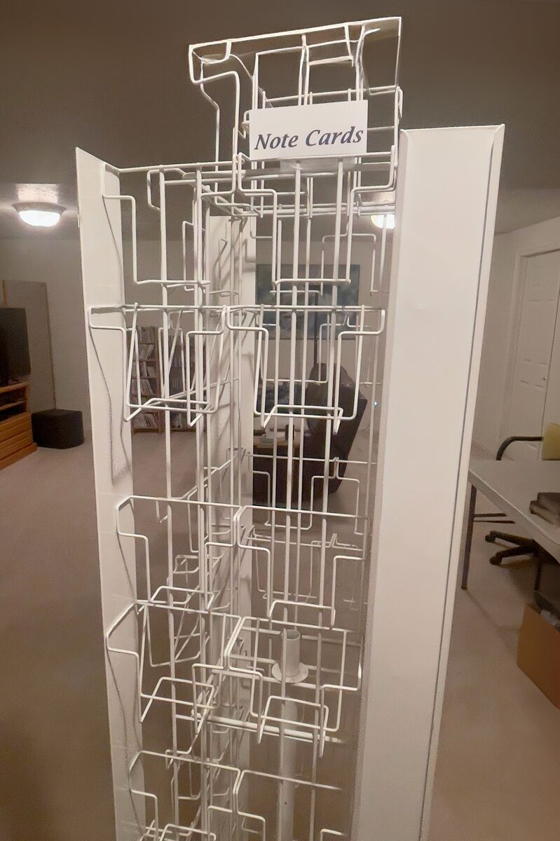 ROTATING CARD RACK WITH 60 DISPLAY POSITIONS ON FOUR SIDES