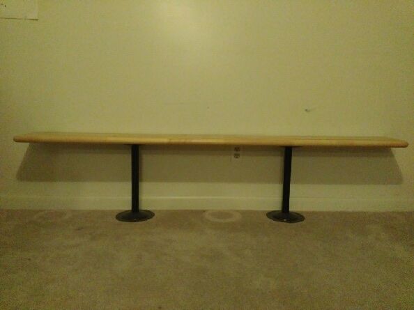 Long Wooden Benches with Two Black Metal Pedestal Bases - Versatile Furniture Piece