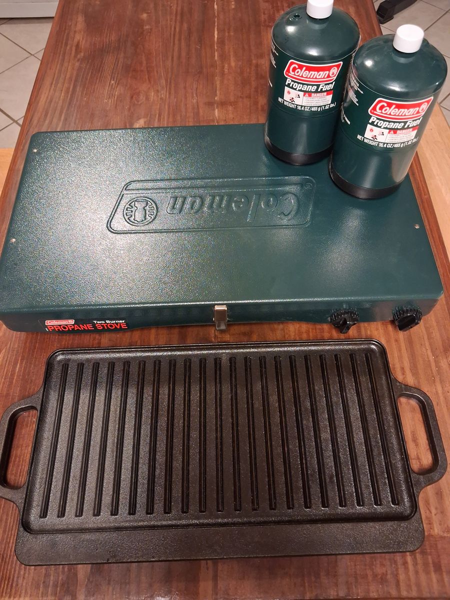 Coleman Camp Stove, Propane Tanks, and Cast Iron Skillet