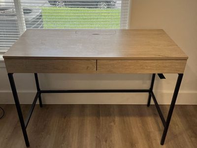 Modern Light Wood Grain Standing Desk with Dual Drawers and Black Metal Frame