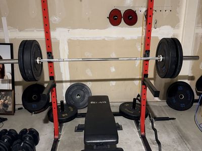 Squat rack with 300 pounds rubber bumper plates
