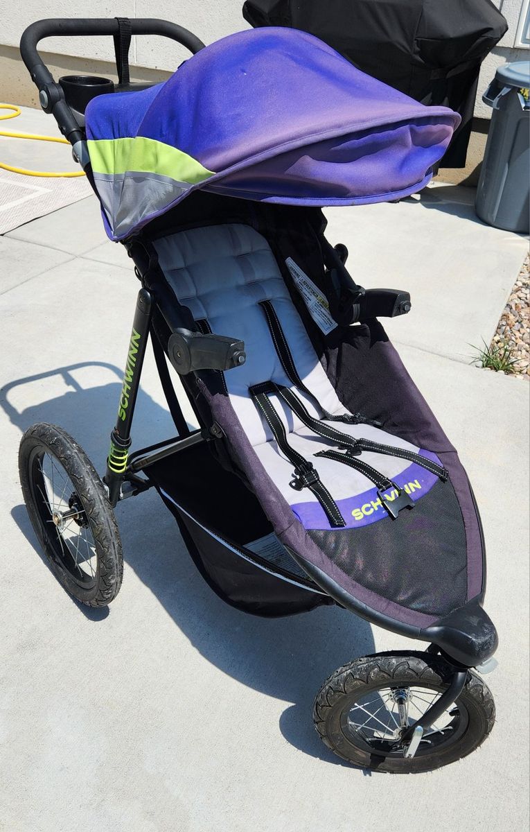 Schwinn Interval Jogging Stroller - Purple/Black 3-Wheel Design with Parent Console and shock absorbers