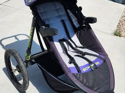 Schwinn Interval Jogging Stroller - Purple/Black 3-Wheel Design with Parent Console and shock absorbers