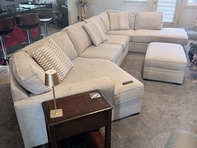 Beige U-Shaped Sectional Sofa with Storage Ottoman and Pillows