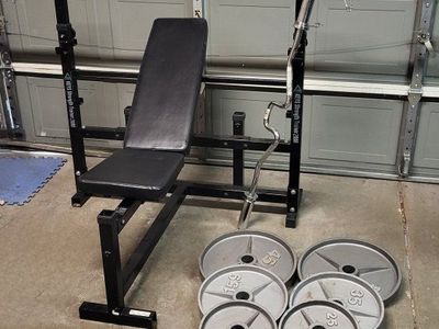 Bench and 255 pounds of weights