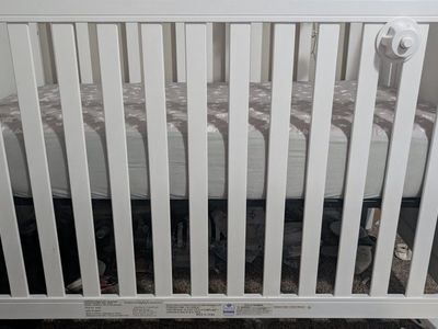 crib and mattress and mobile