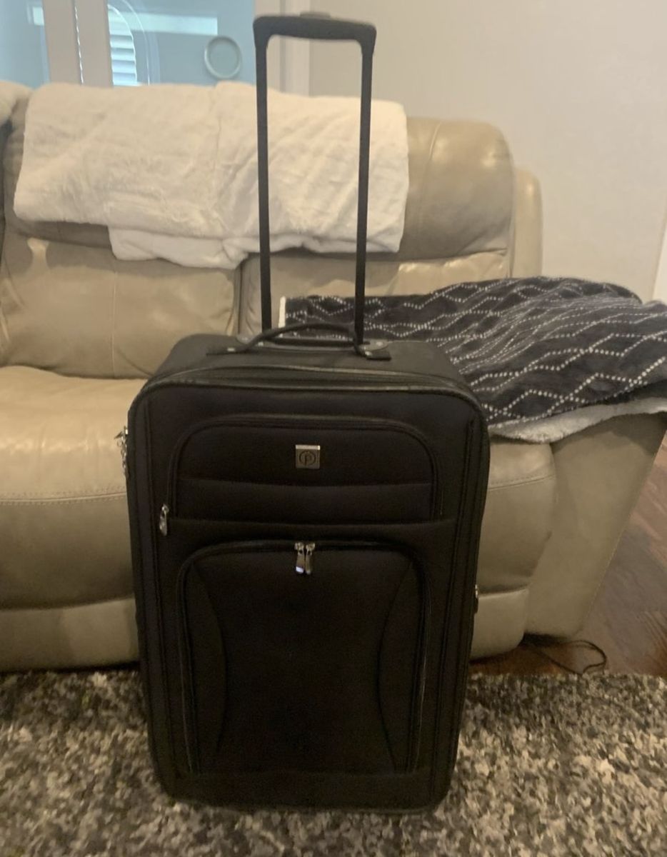 Traveler's Choice Black Soft-Sided Carry-On Suitcase with Spinner Wheels