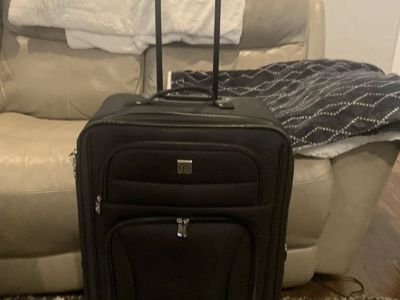 Traveler's Choice Black Soft-Sided Carry-On Suitcase with Spinner Wheels