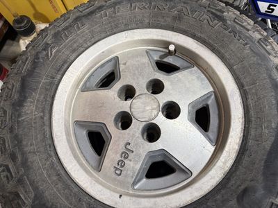 Jeep Cherokee rims and tires $100 OBO