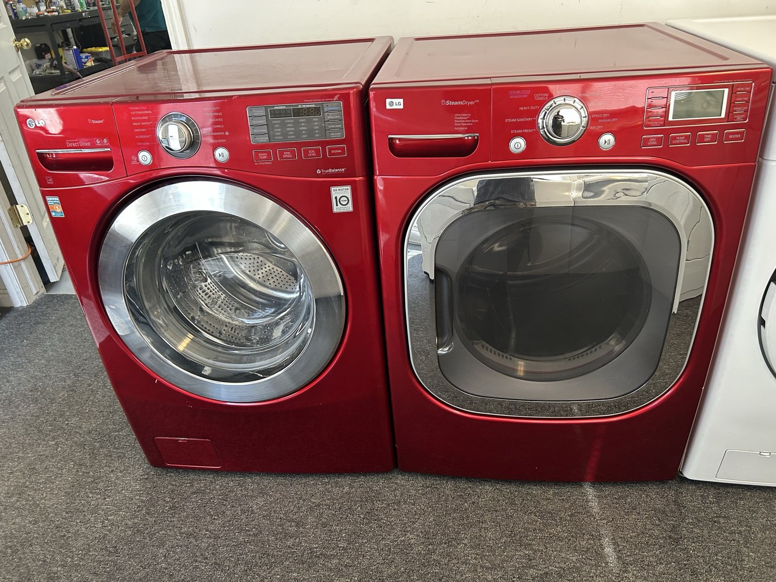 Red LG washer and electric dryer