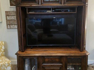 large solid wood entertainment center