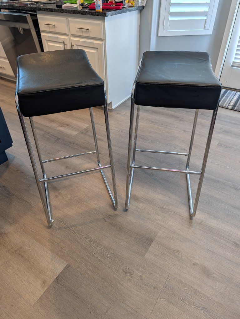 2 Black Faux Leather & Chrome Saddle Stools - Modern Bar Height Seating