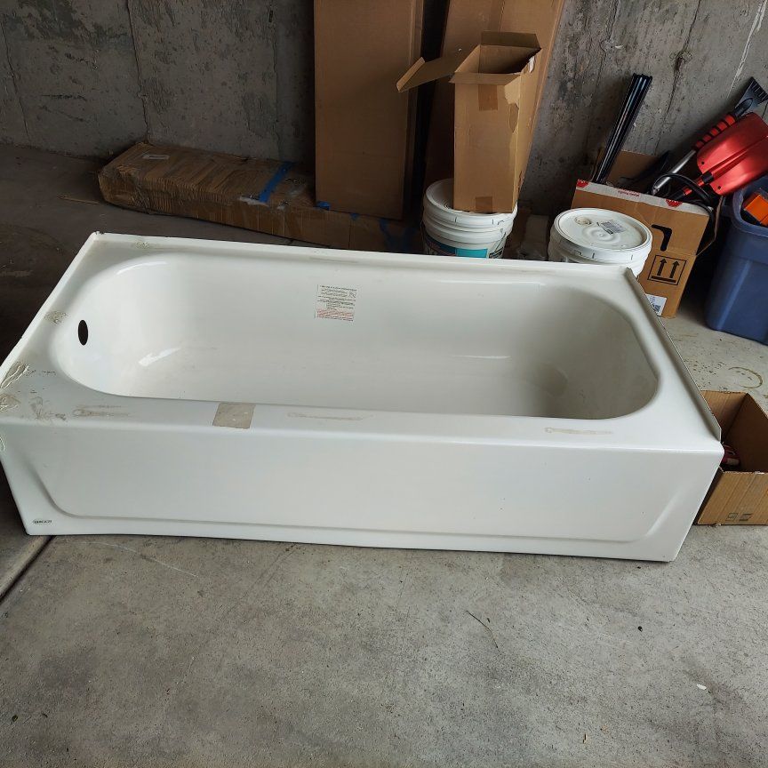White Bathtub Plumbing Fixture