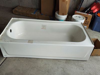 White Bathtub Plumbing Fixture