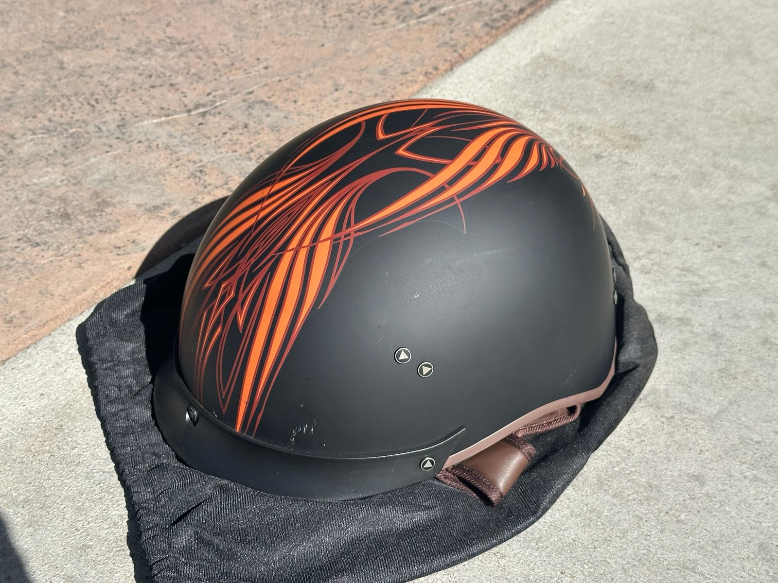 Large Matte Black Motorcycle Helmet with Orange Pinstripe Graphics and Sun Visor