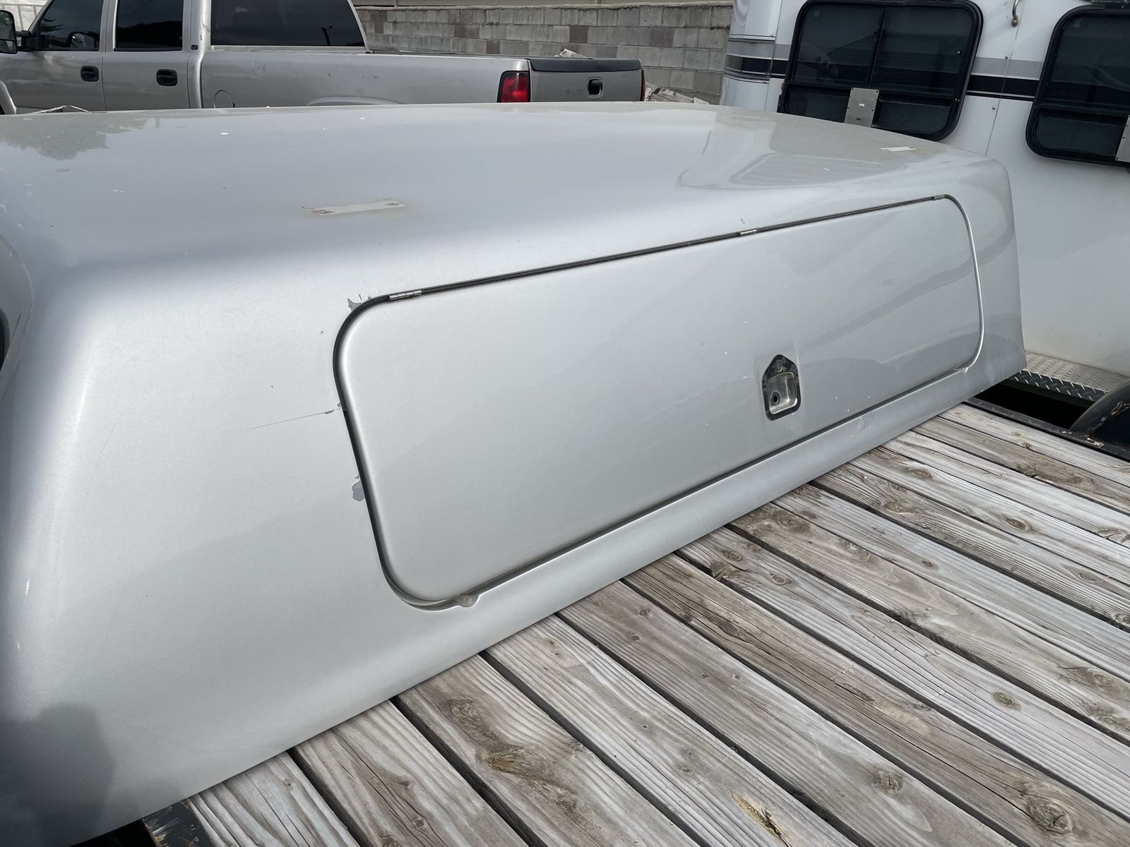 Silver Truck Camper Shell Topper with Side Access - For Sale