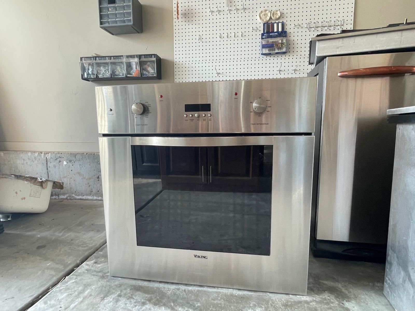 Viking Stainless Steel Kitchen Appliance Set: Wall Oven, Gas Cooktop, Beverage Cooler, Trash Compactors, and Proofing Drawer.
