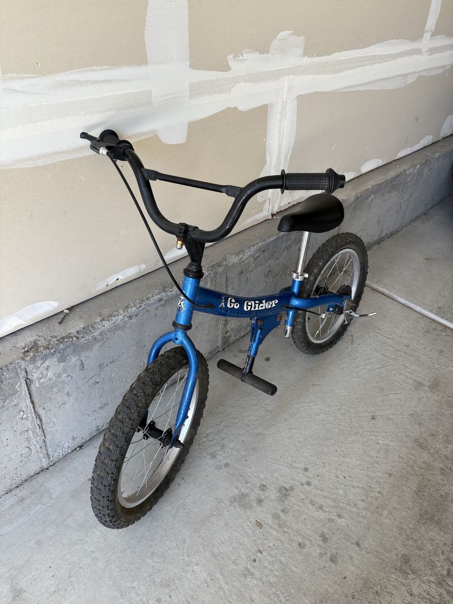 Go Glider Blue Kids Balance Bike with Foot Pegs and Hand Brake