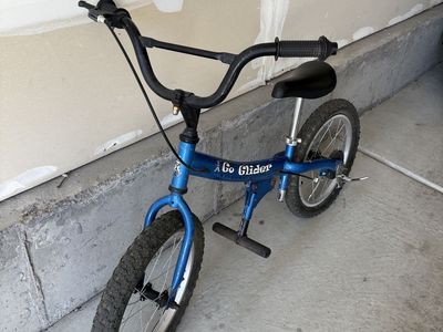 Go Glider Blue Kids Balance Bike with Foot Pegs and Hand Brake