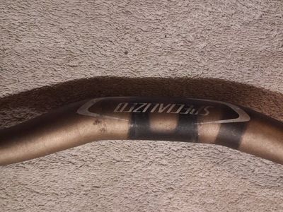 Specialized brand bicycle riser handlebar