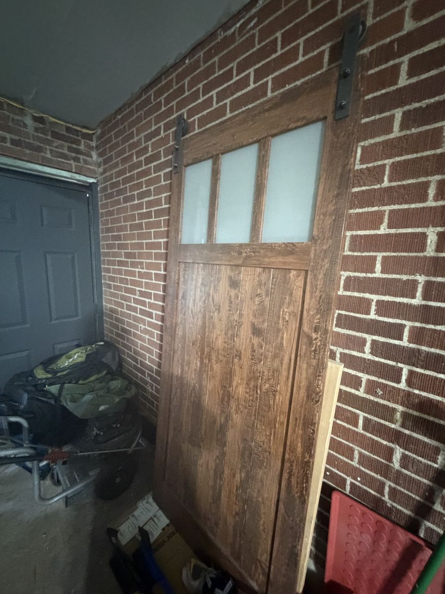 Interior sliding barn door with track