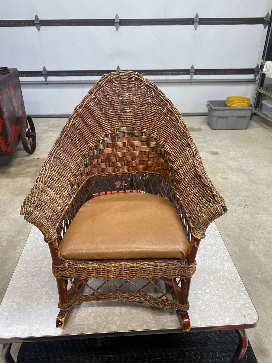 Antique Beautiful Childs wicker rocking chair. Unique and valuable.