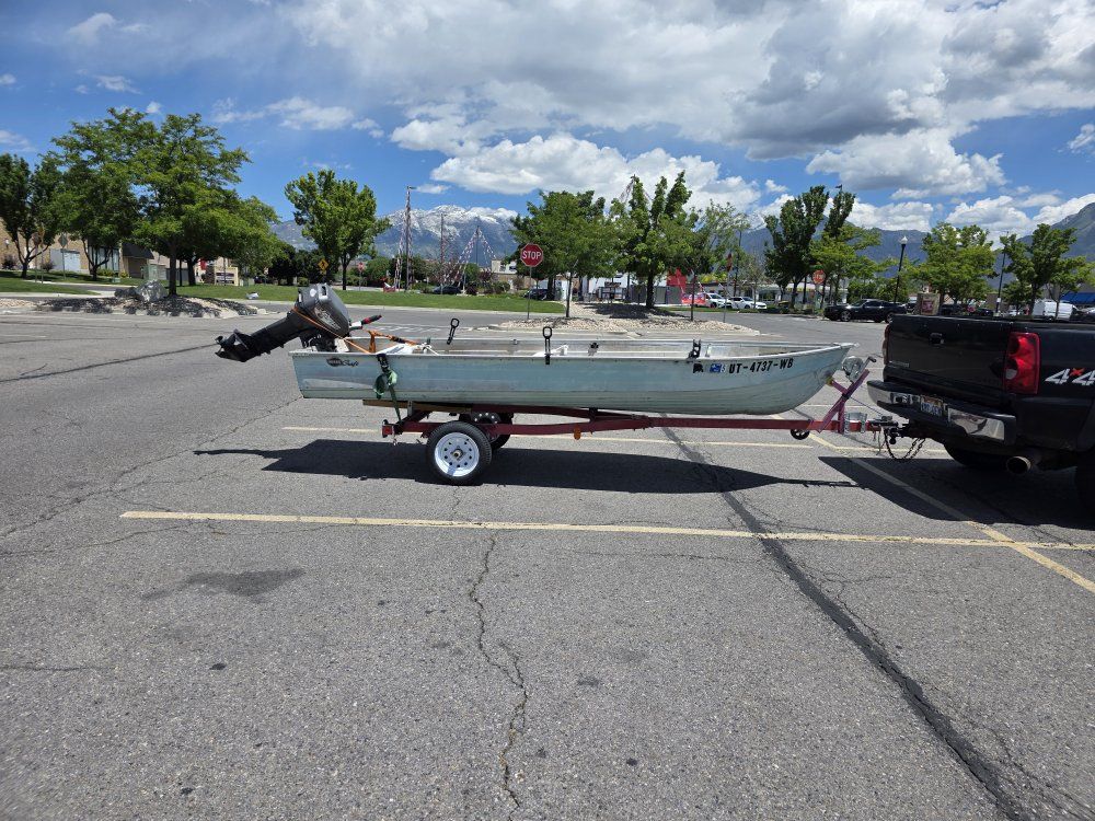 Aluminum Fishing Boat with 15 HP Outboard Motor - Ready for the Water