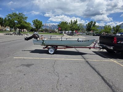 Aluminum Fishing Boat with 15 HP Outboard Motor - Ready for the Water