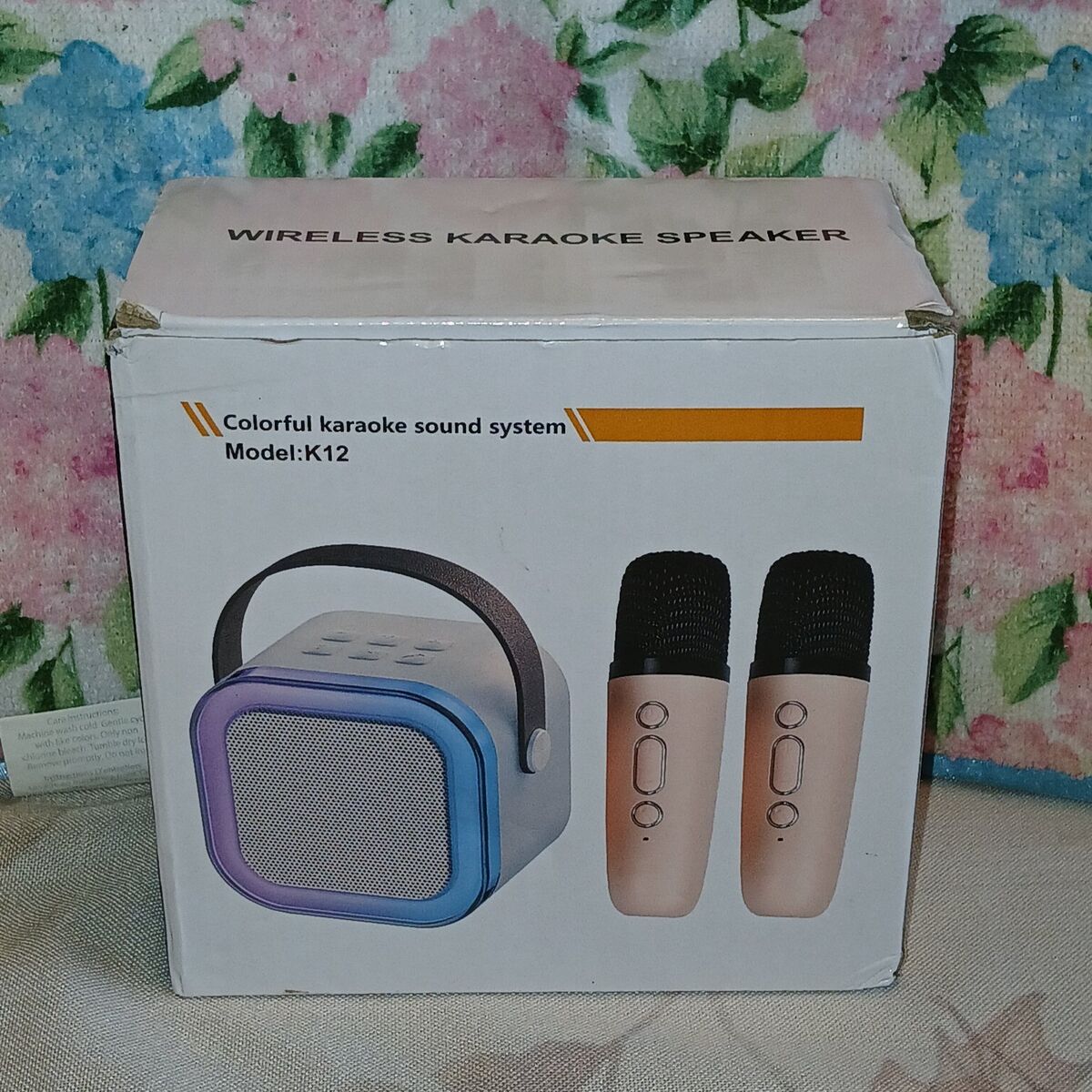 A purple wireless karaoke speaker