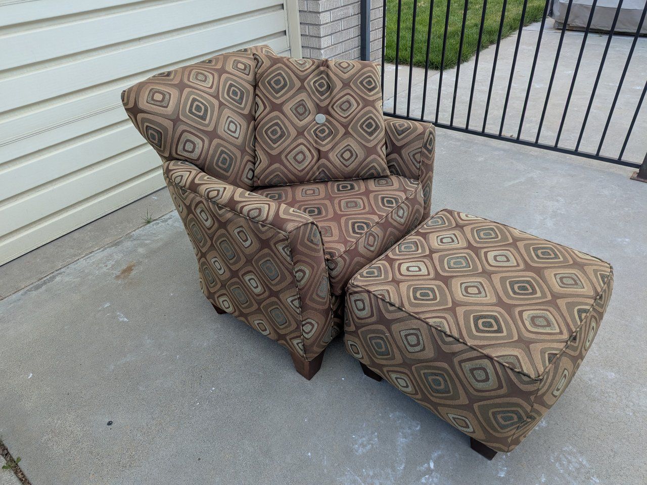 Used brown patterned armchair with ottoman
